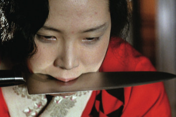 《感官王国》，1976，35毫米彩色影片截图，101分钟。松田英子。