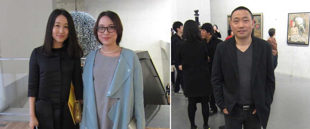 左：策展人胡丹洁与中国美术馆的杨子；右：艺术家周啸虎.